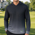 A man standing on a golf course wearing a dark gray long-sleeve hoodie with a subtle hexagonal pattern that fades into a lighter gray at the hem. A small green and white 'Golf Outfitters' logo is visible on the lower right front of the hoodie.