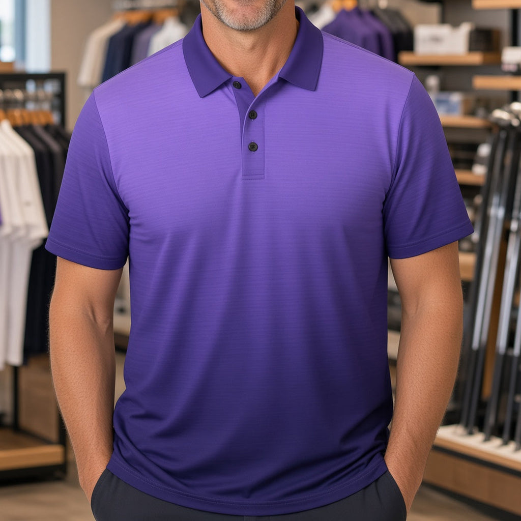 A smiling man wearing a purple short-sleeve polo shirt stands inside a retail store with shelves and clothing racks visible in the background.