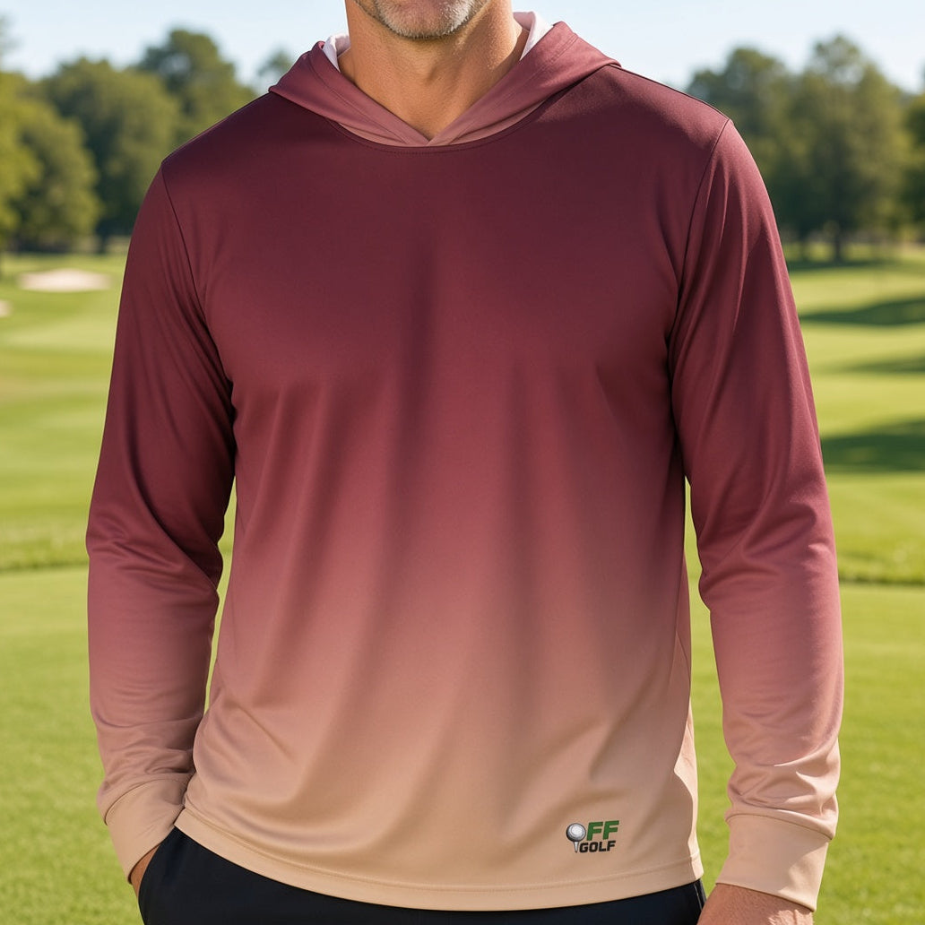 A man wearing a long-sleeve gradient hooded shirt stands on a golf course. The shirt features a color-shifting design that transitions from a deep burgundy at the top to a light beige at the bottom, with a small 'EF GOLF' logo near the lower hem.