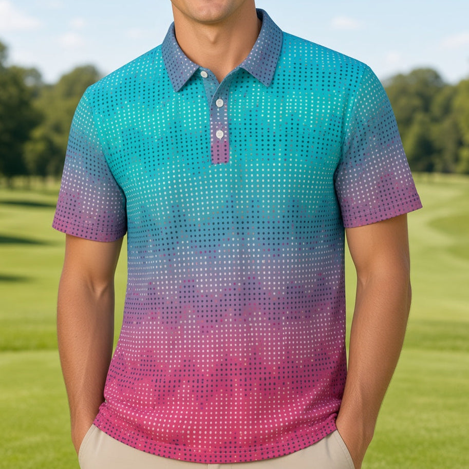 A smiling man stands on a golf course wearing a short-sleeve polo shirt with a blue-to-purple-to-pink gradient pattern and khaki pants.