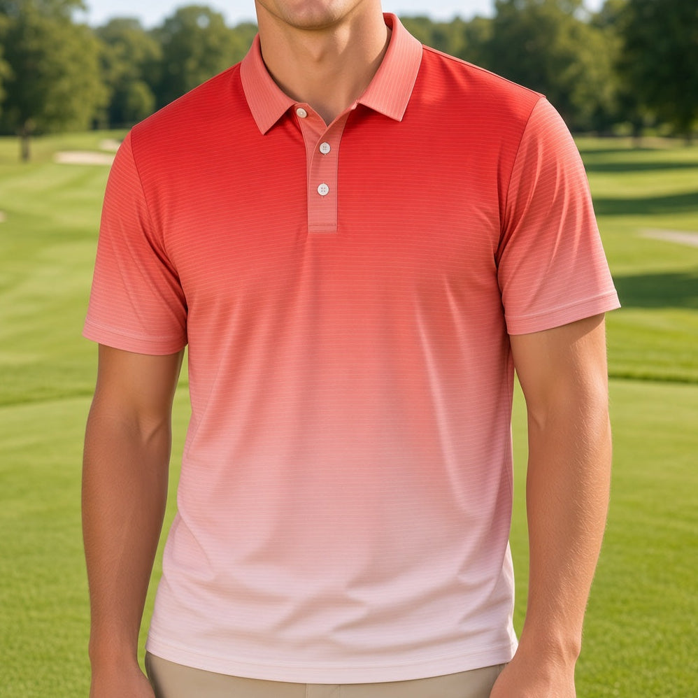 A smiling man wearing a coral-to-pale-pink gradient polo shirt stands on a sunny golf course.
