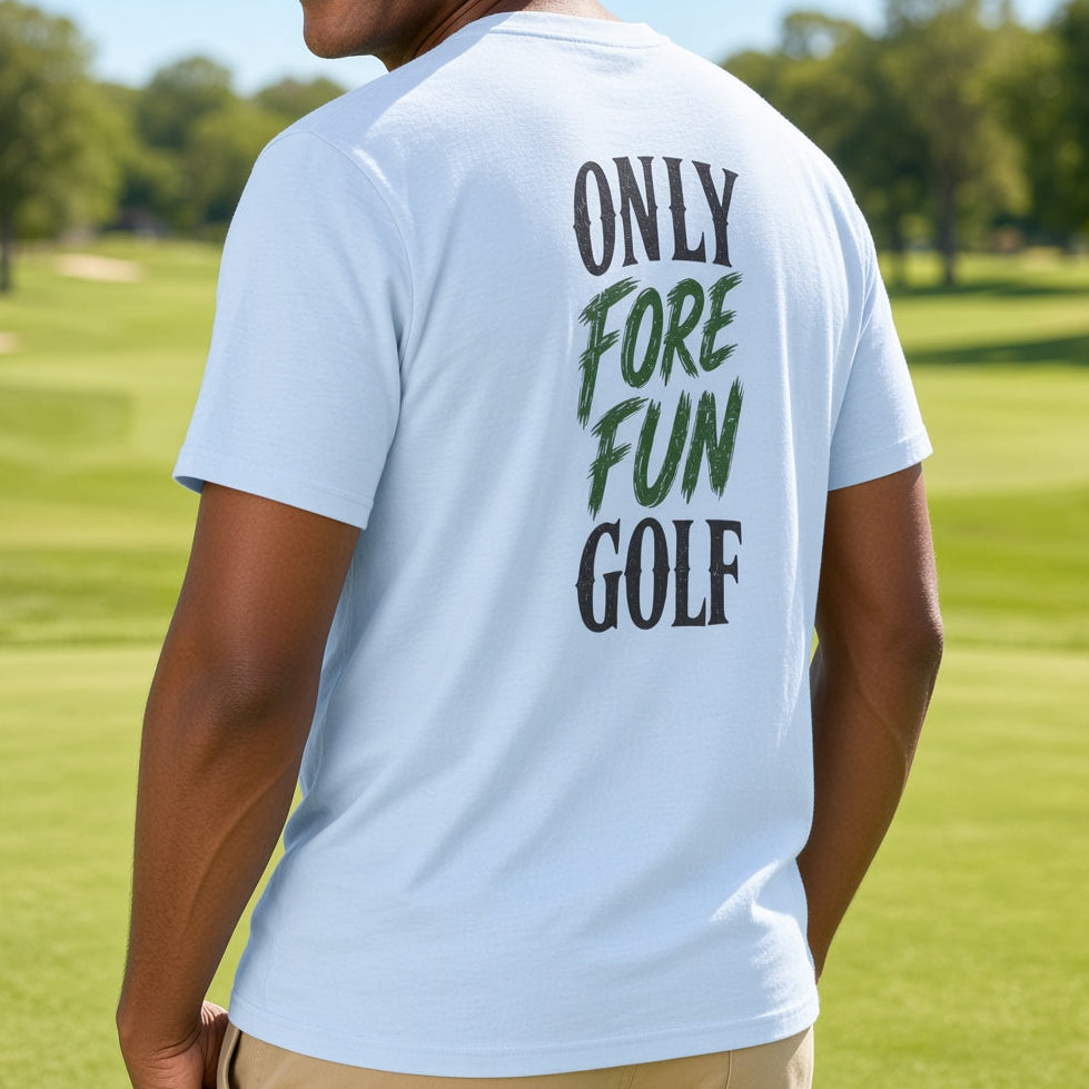 A man standing on a golf course wearing a light blue t-shirt with the back graphic reading 'ONLY FORE FUN GOLF' in dark green and black lettering.