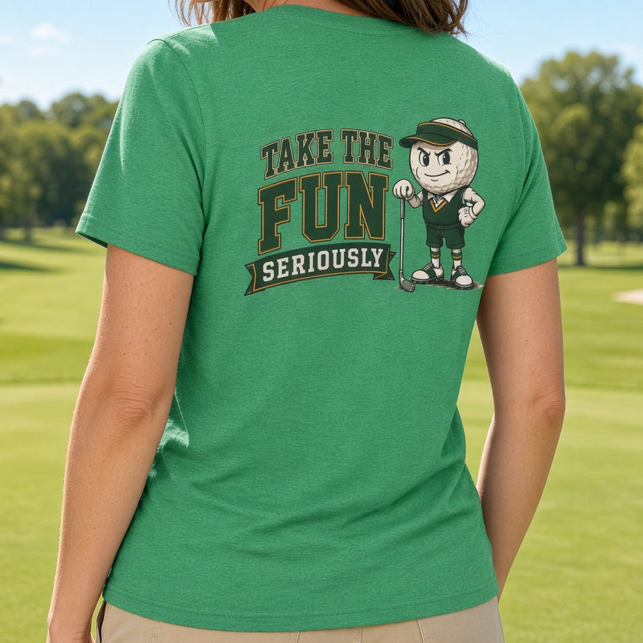 A woman standing on a sunny golf course wearing a bright green t-shirt with a graphic on the back that reads 'TAKE THE FUN SERIOUSLY' next to a cartoon character.