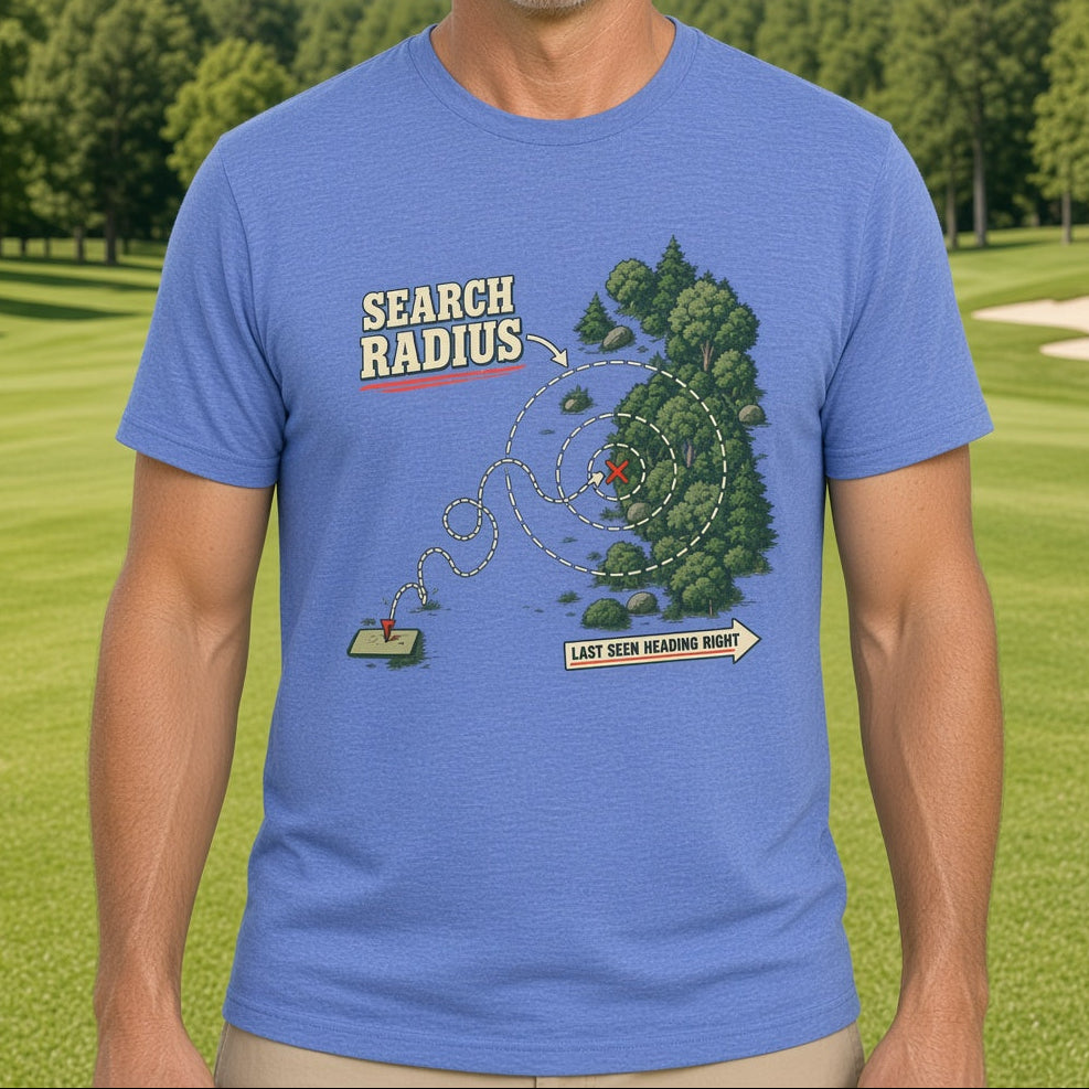 A smiling man wearing a blue graphic t-shirt with a golf course map design that reads 'SEARCH RADIUS' and 'LAST SEEN MEASURING RADIUS', set against a background of a green golf course under a blue sky.