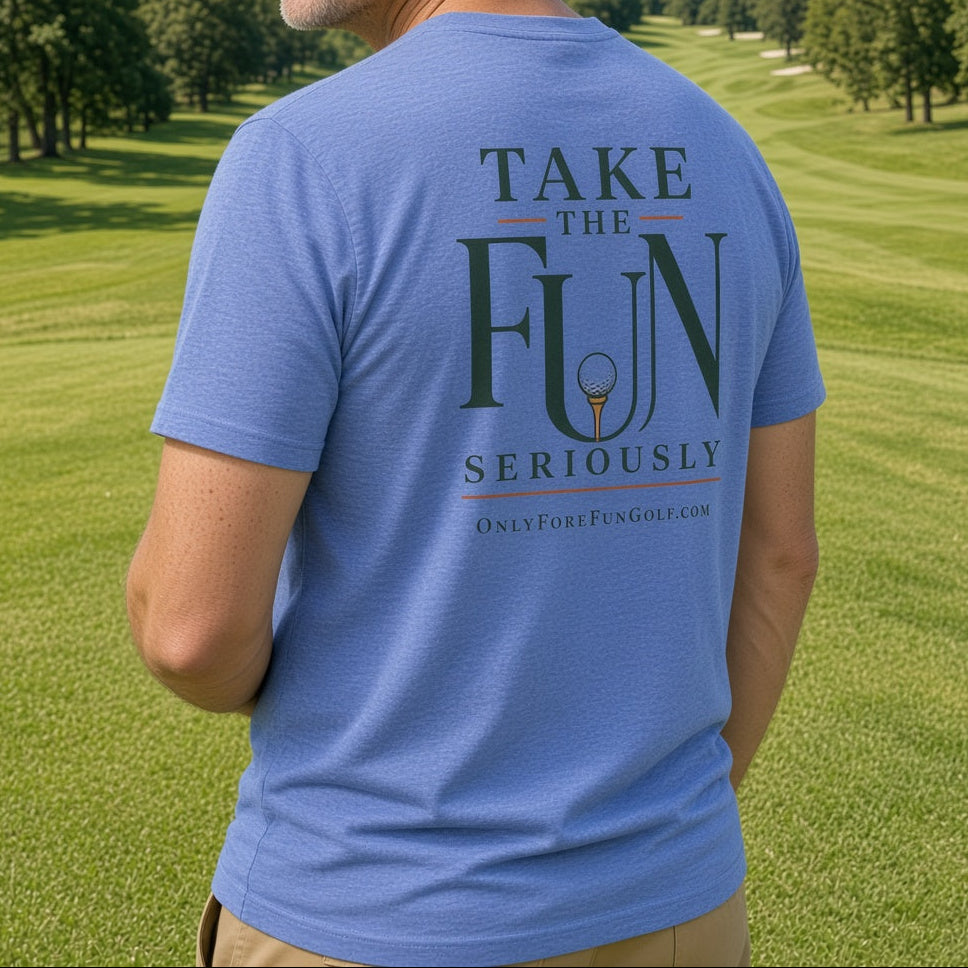 A man standing on a golf course wearing a blue t-shirt with a dark green graphic on the back that reads 'TAKE THE FUN SERIOUSLY' and 'OnlyForFunGolf.com'.