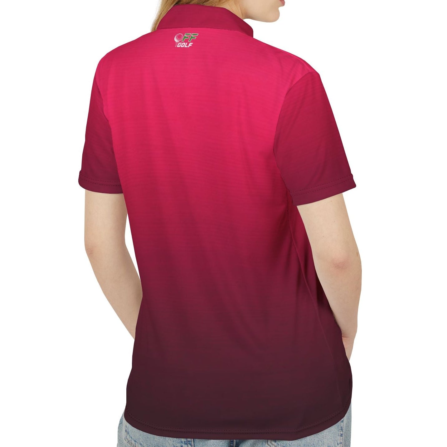 A woman shown from the back wearing a short-sleeve polo shirt with a vertical color-block gradient from bright magenta pink to deep burgundy. The shirt features a small embroidered logo on the upper left back.