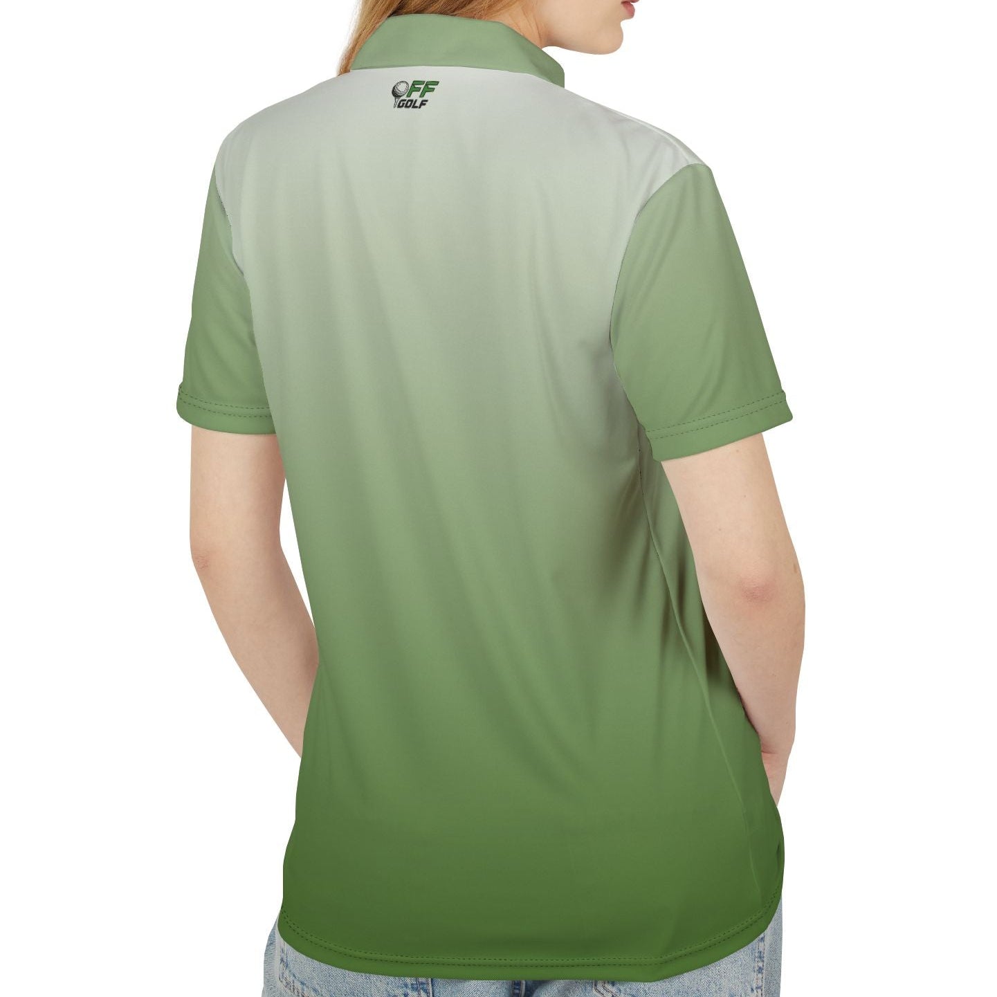 A woman shown from the back wearing a short-sleeve polo shirt with a green-to-light-gray gradient design and a small crest logo on the upper back, paired with light blue jeans against a plain white background.