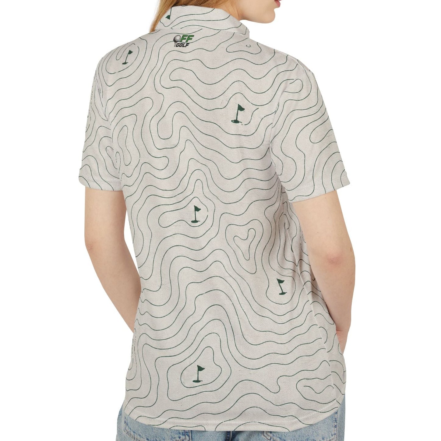 A woman shown from the back wearing a short-sleeve polo shirt with a light beige background and a dark gray topographic contour line pattern, paired with light blue jeans, against a plain white background.